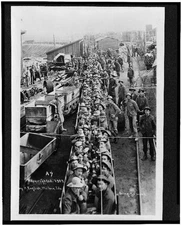 Going,work,railroad cars,mines,ore industry,employment,workers,Idaho,ID,c1909