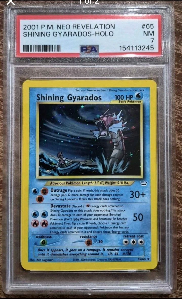 2001 POKEMON NEO REVELATION #65 SHINING GYARADOS-HOLO PSA 7