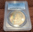 1883-O PCGS MS65 Rainbow toned Morgan Silver Dollar