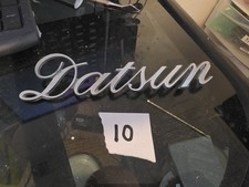 Vintage 1970s Datsun Cursive Metal Emblem Script Oem..1200