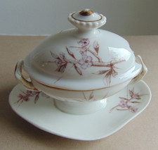 Ancien moutardier en  porcelaine forme soupière à décor floral