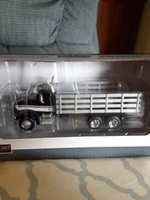 NIB 1/64 Black Pete 385 Stakebed SpecCast