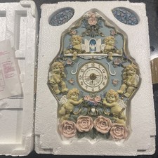 Horloge murale vintage chérubins et roses 1995. A réparer