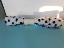 FUR LOOK FABRIC FOR FUN CRAFTING IS WHITE WITH BLACK SPOTS