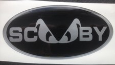 SCOOBY EVIL EYE DOMED SUBAR BONNET GRILL  BADGE BLACK & SILVER 75 X 45MM 92-01