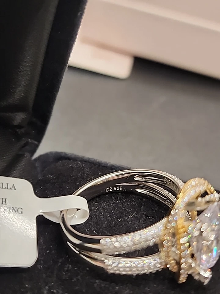 Anillo solitario enchapado en platino 925 ovalado circonita cúbica 9,31 quilates con acento de remolino de 18 quilates talla 12 Foto 4 de 4