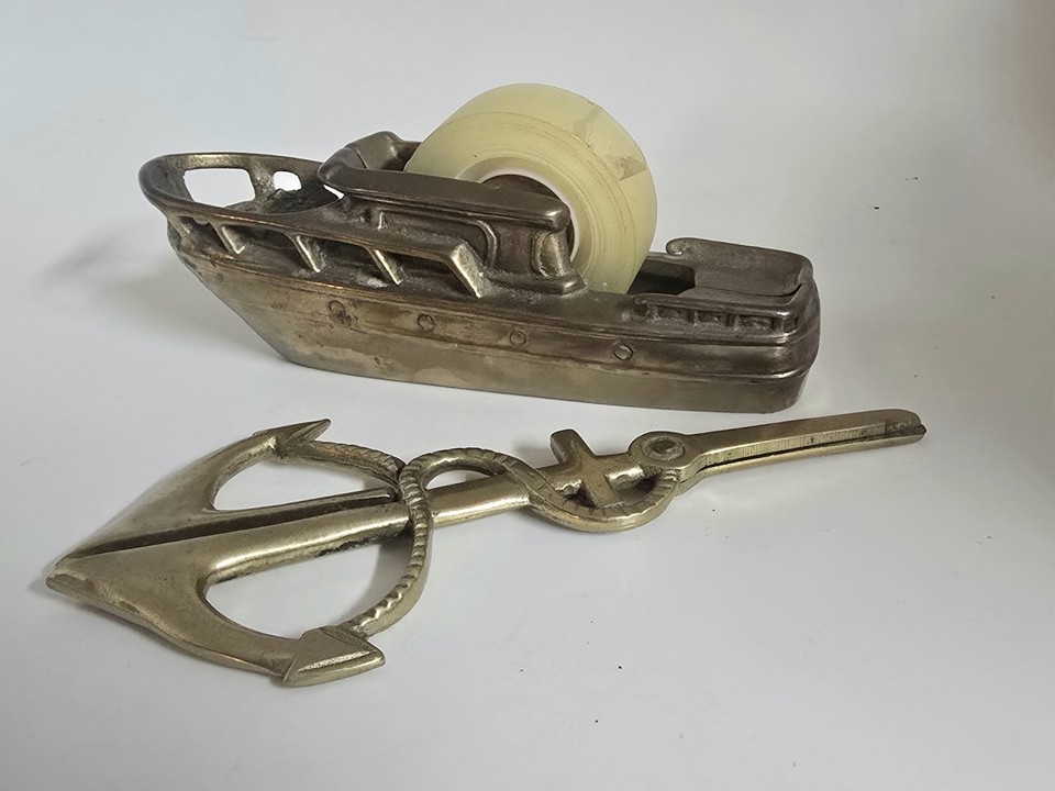 A full solid brass MCM cabin cruiser desk set — tape dispenser, anchor scissors, and more — this is the kind of insane collectible set that interior designers and mad collectors fight over.