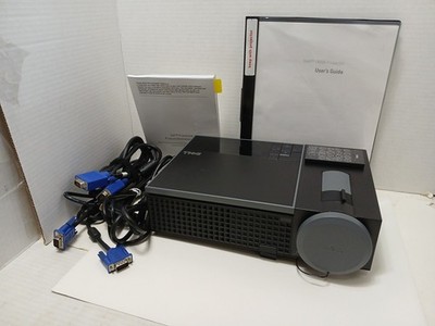Dell 1409X 2500 Lumens DLP Projector with VGA cable and power cord.