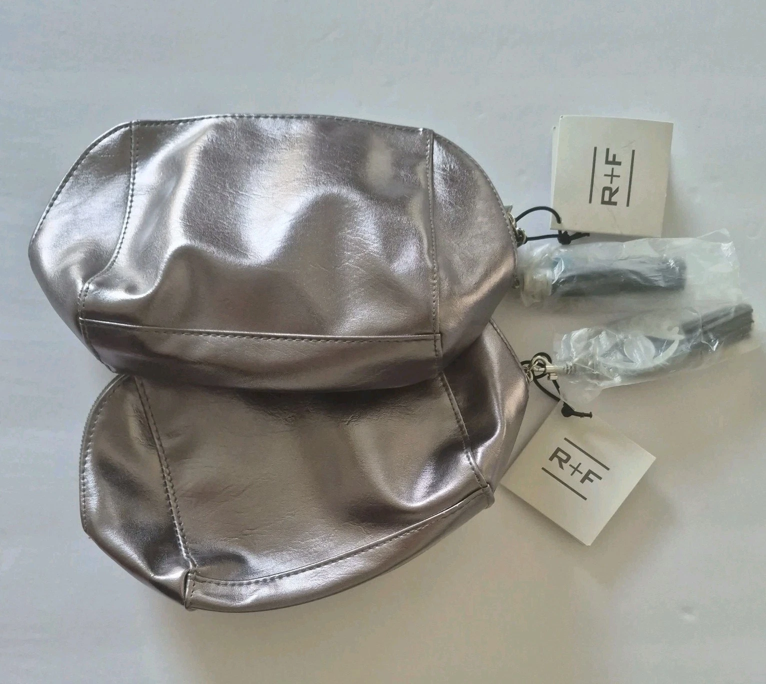 ​(Lot of 2) Rodan + Fields Metallic Pewter Makeup Bag NWT Eye Pattern Lining