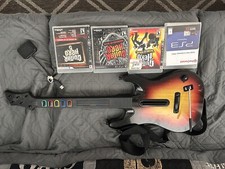 Guitar Hero PS3 Bundle. Guitar, Dongle, and Four Games.