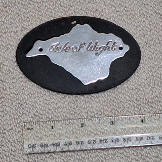 VINTAGE ISLE OF WIGHT CHROME CAR BADGE.