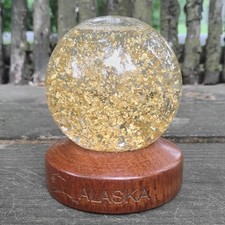24K Gold Leaf Filled Snow Globe On Wooden Bas...
