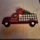 ADVENT COUNTDOWN TO CHRISTMAS RED CALENDAR TRUCK.                               