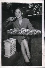 1955 Press Photo Lella Arnaud enjoys some of the fruits of her writing efforts