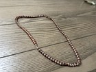 Red, white, and gold beaded necklace with alternating red and white beads #beade — photo 3