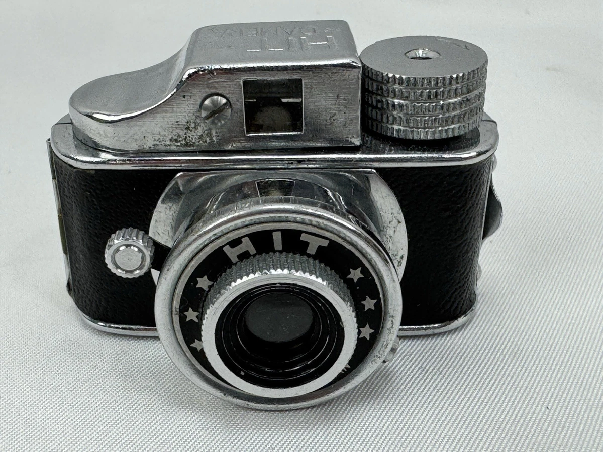 Une caméra vintage à la main | Vecteur Gratuite