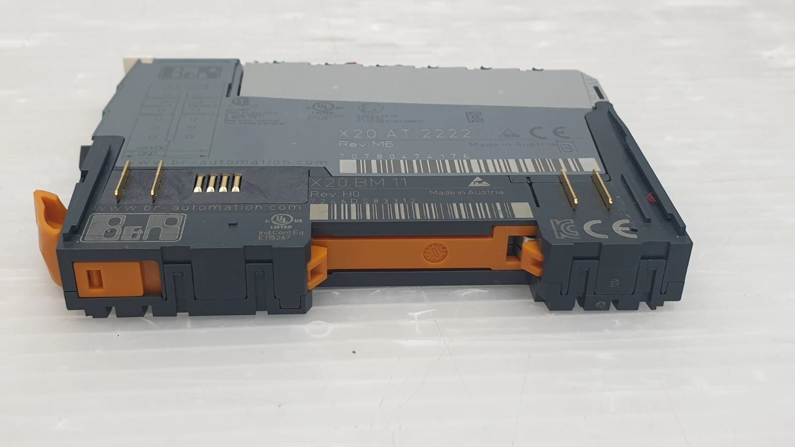 B&R X20AT2222 module with X20BM11 base, side view with orange locking lever