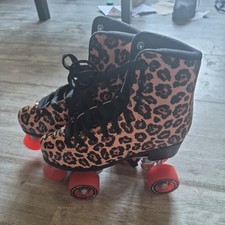 Roller skates, impala, red wheels and cheetah print