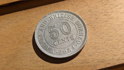 Malaya & British Borneo 50 Cents coin. About UNC