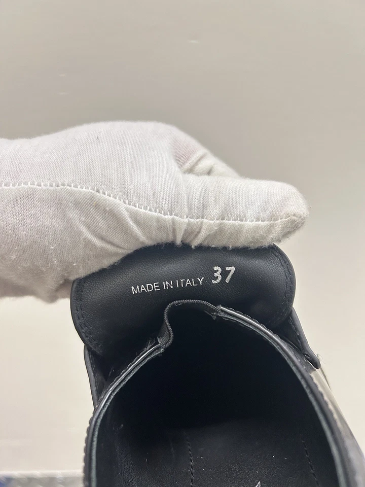 Mocasines planos sin cordones de cuero Prada para mujer triángulo grueso sin usar, en caja 7 EE. UU. 37 UE Foto 2 de 4