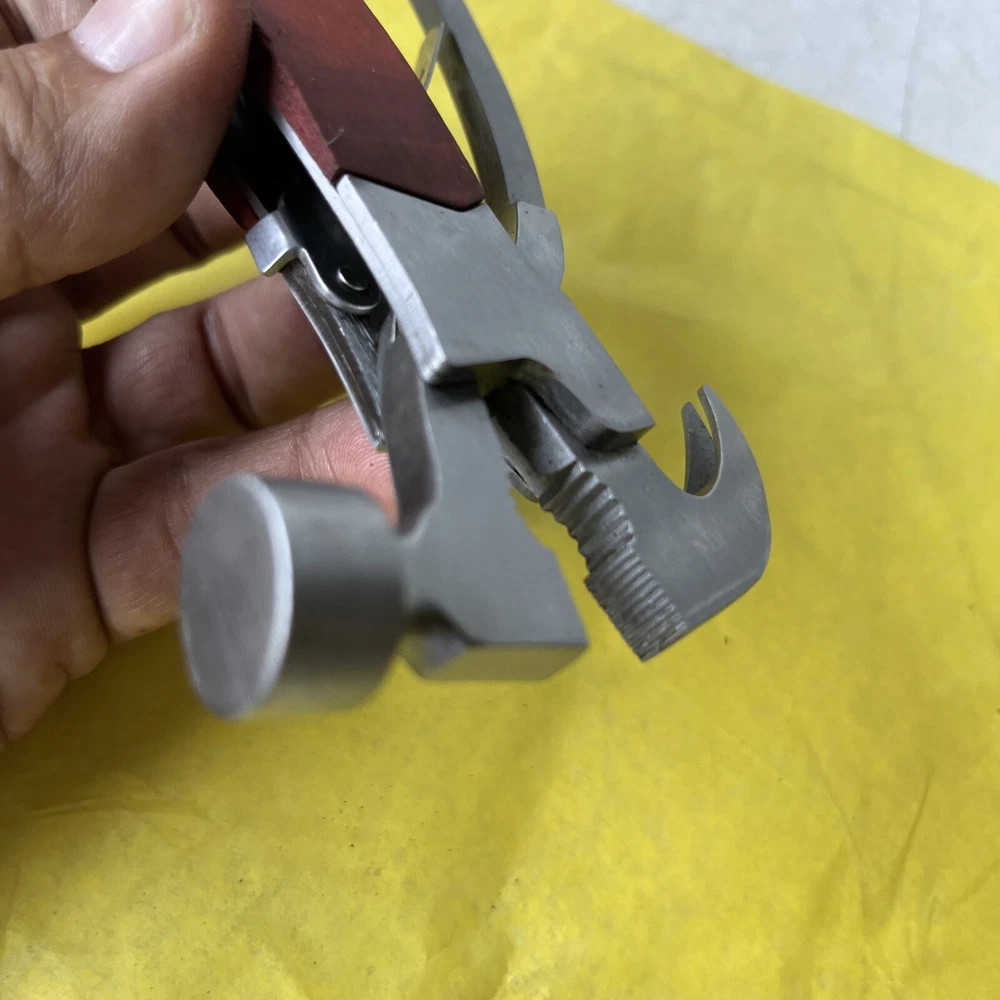 Compact Unbranded Multi-Tool with Knife, Saw, Hammer, Pliers & Bottle Opener (t11)