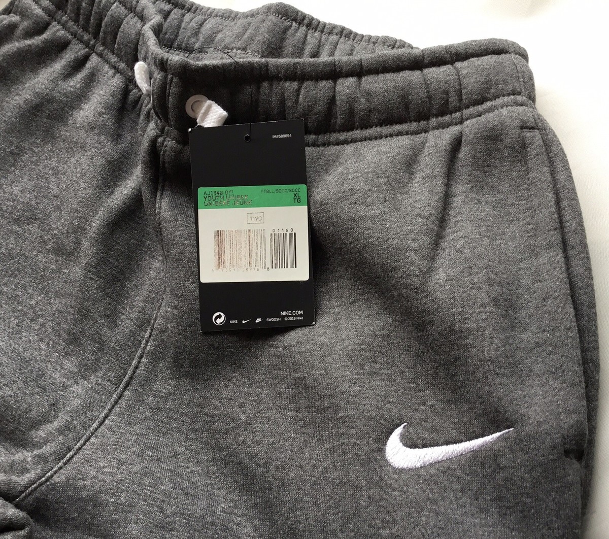 grey nike tracksuit bottoms junior