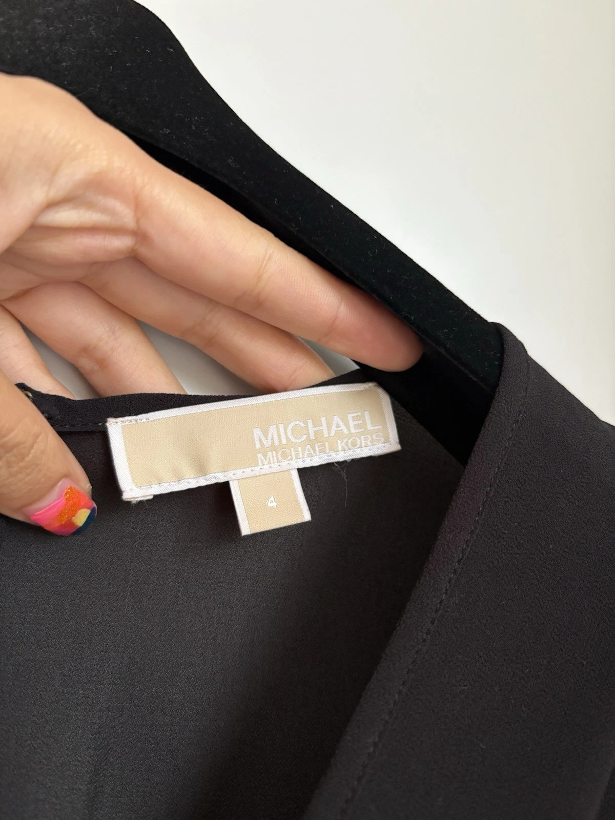 Mini abito nero Michael Kors foderato con volant scollo a V manica lunga prezzo consigliato £ 200+ 