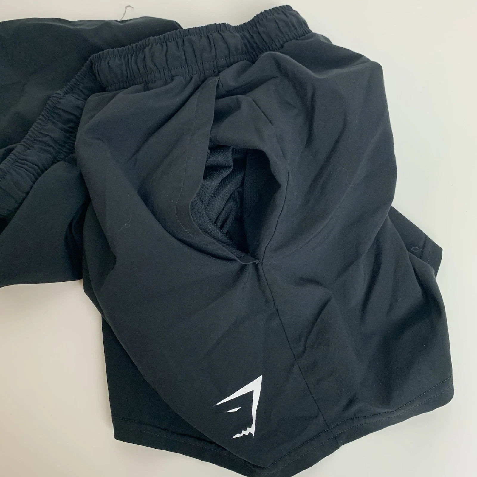 gymshark training loose fit crest logo pre owned shorts