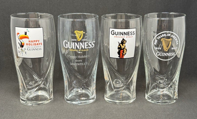 4 GUINNESS 20oz Beer Glasses Embossed Harps Lion Toucan Happy Holidays Draught
