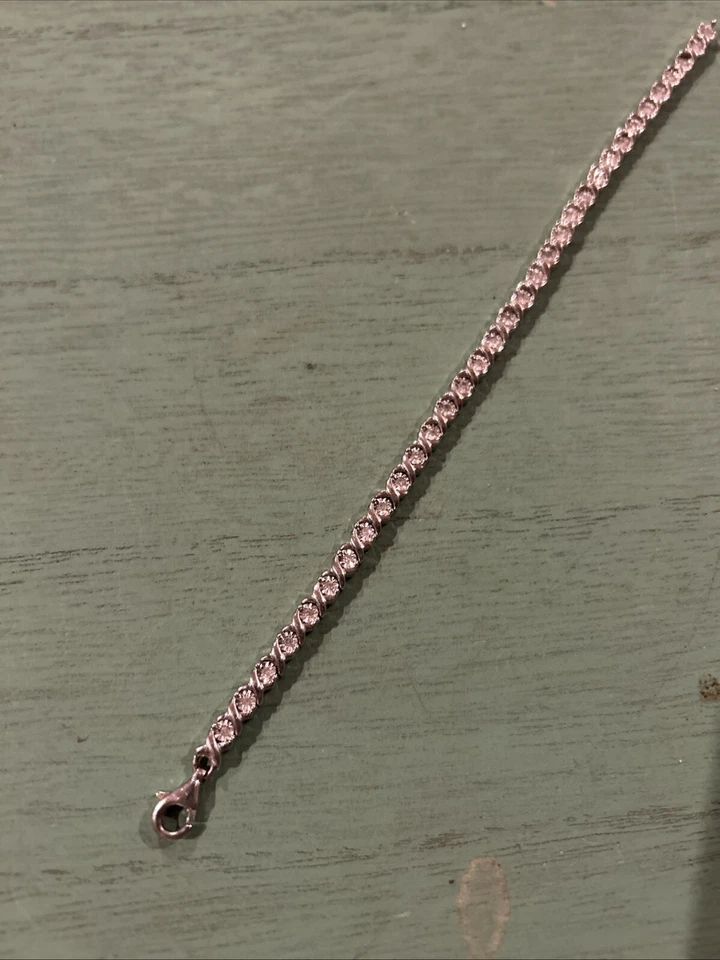 Brazalete de tenis de diamantes Jared Jewelers de plata de ley de corte redondo de 1/3 quilate Foto 3 de 4