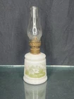 Miniature milk glass oil lamp with green illustration of house and landscape