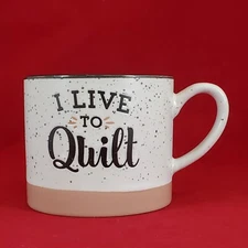 Adorable "I live to Quilt" 12 oz Stoneware Mug Speckled White and Mauve