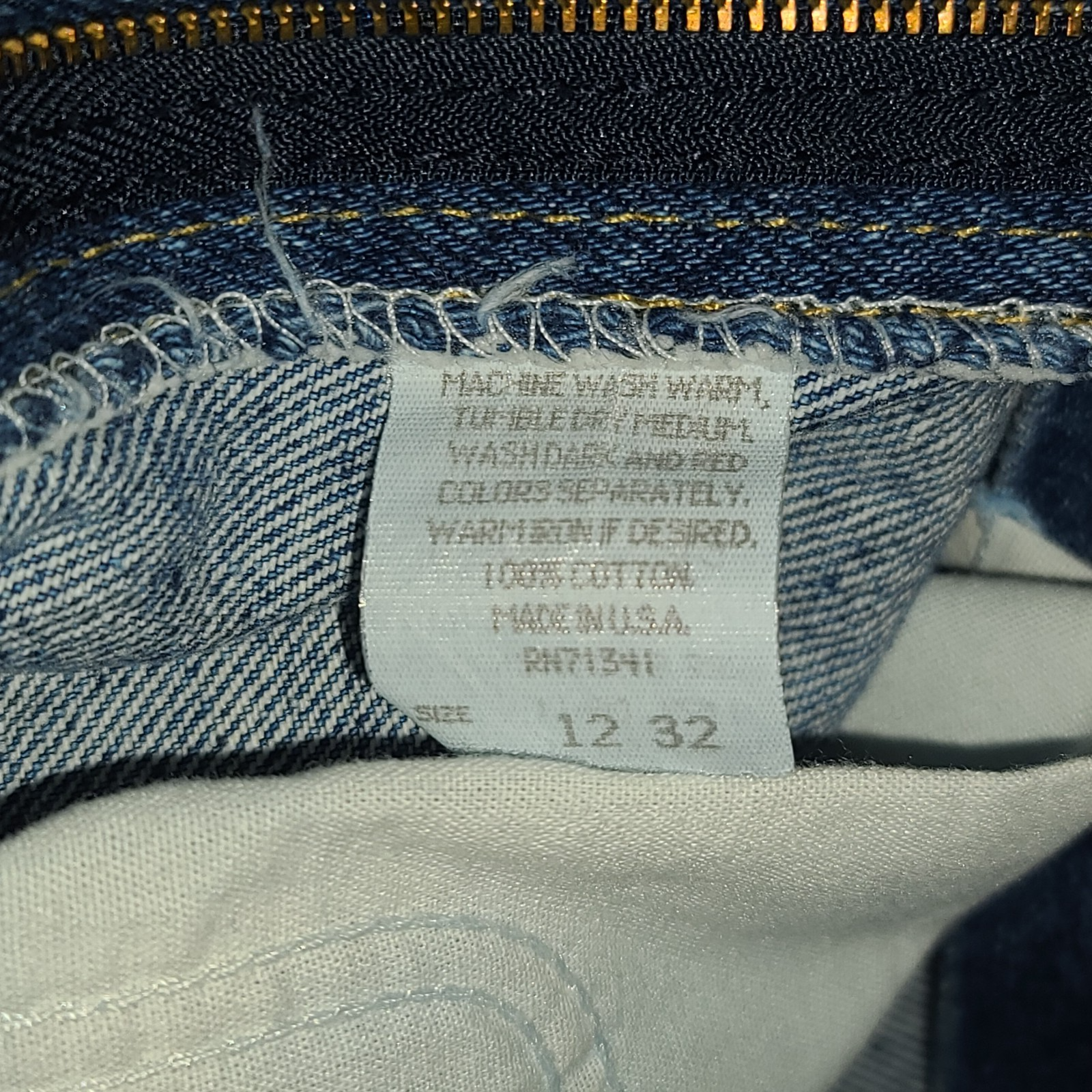 Vintage L.L.Bean high-waisted mom jeans, blue denim, size 12 32, with yellow printed inner label text.