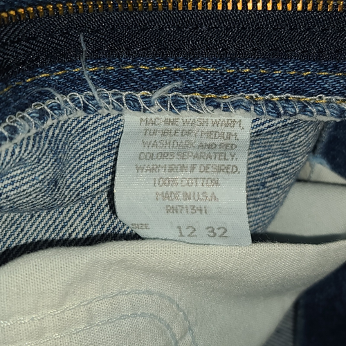 Vintage L.L.Bean high-waisted mom jeans, blue denim, size 12 32, with yellow printed inner label text.