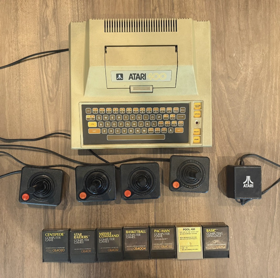 Vintage ATARI 400 Computer Console with 4 joysticks and 7 games.