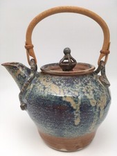 Beautiful Handmade Artisan made in USA teapot with bamboo handle. Beautiful Handmade Artisan made in USA teapot with bamboo handle.