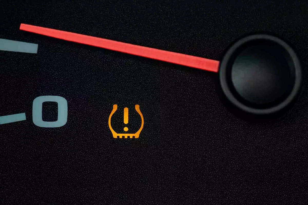 An illuminated TPMS light on a vehicle’s speedometer.
