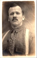 GENTLEMAN APPEARING SAD :DRESSED FOR WORK : ARTURA STAMP BOX : RPPC  1908-1924