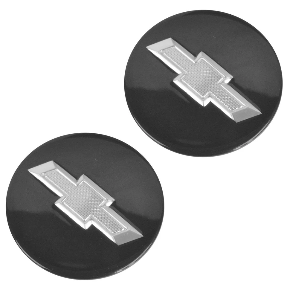 Par de tapacubos centrales de rueda OEM 22791586 negro con pajarita plateada para Chevy Camaro Volt Foto 3 de 4