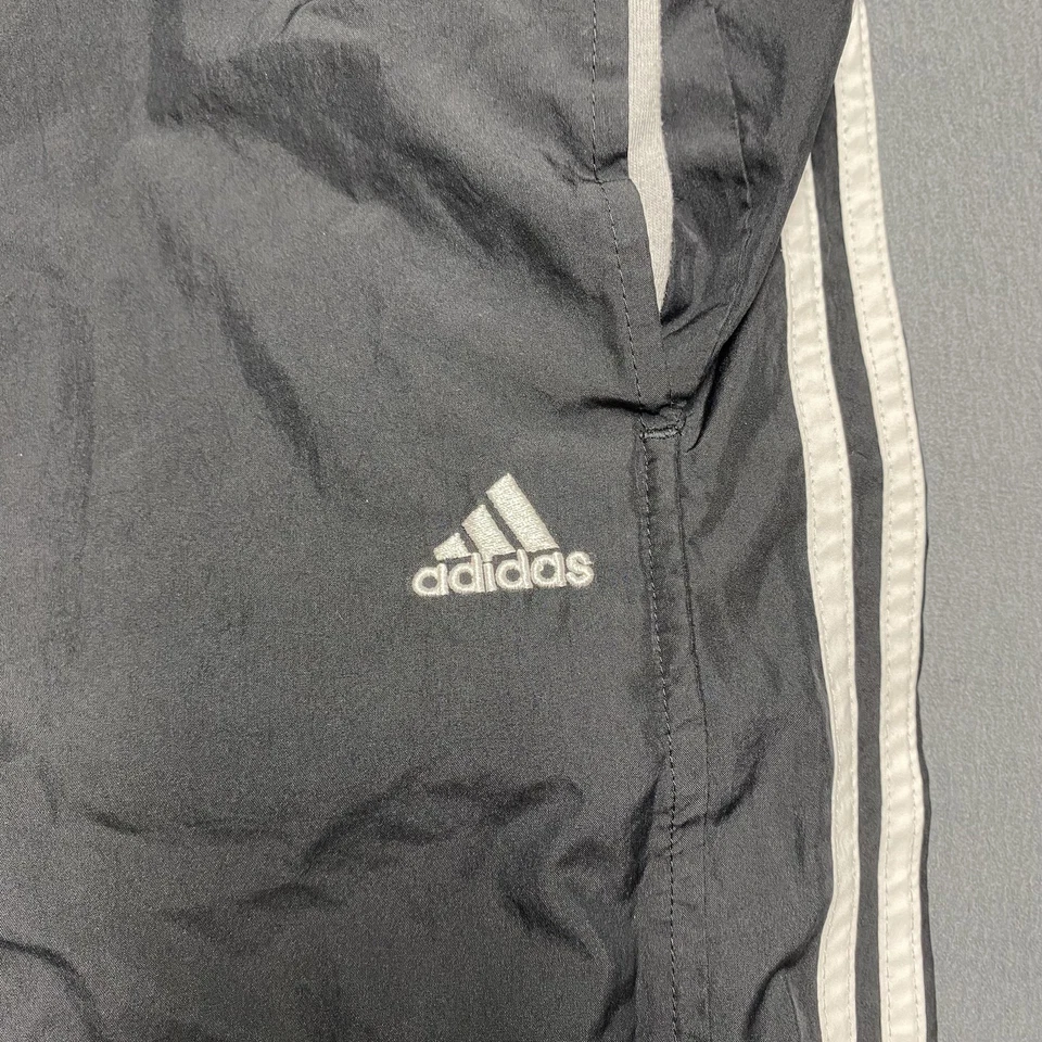 Pantalones Adidas Para Hombre Medianos Negros Calentamiento de Pista 3 Rayas Cremallera Forrados al Tobillo Nylon Foto 2 de 4