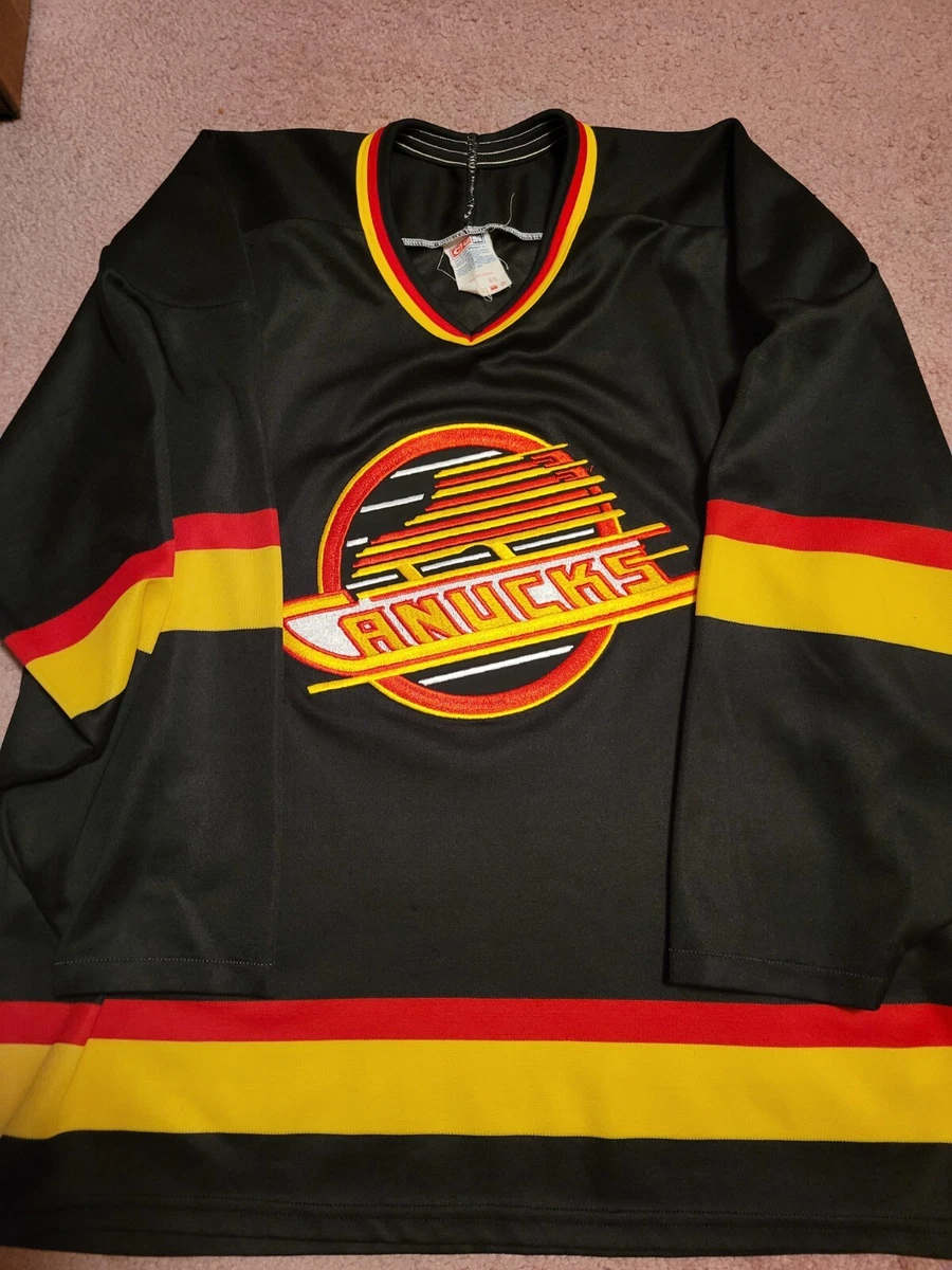 canucks black skate jersey