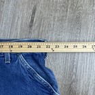 Blue denim Y2K Carhartt men’s carpenter jeans with faded thighs, measured at 44x30 USA made workwear.