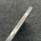 PS3 Sonic's Ultimate Genesis Collection case with clear plastic spine, sealed in protective sleeve on gray surface.