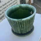 vintage McCoy Pottery Green Bamboo planter with an attached saucer