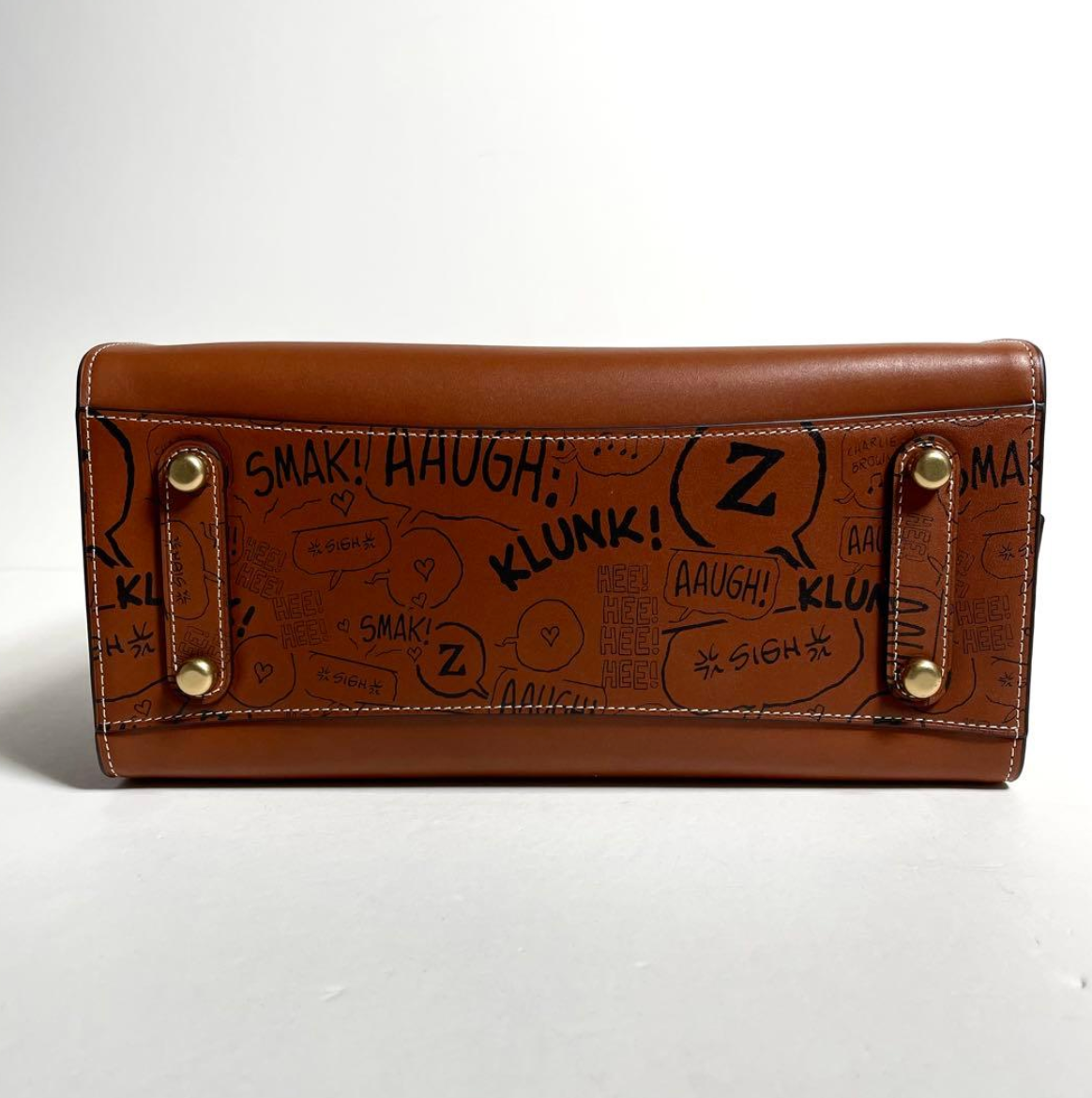 COACH x PEANUTS LIMITED EDITION HAZELNUT NEWSPRINT SNOOPY ROGUE