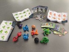 Bakugan 9 Sammelfiguren mit Karten Usw.