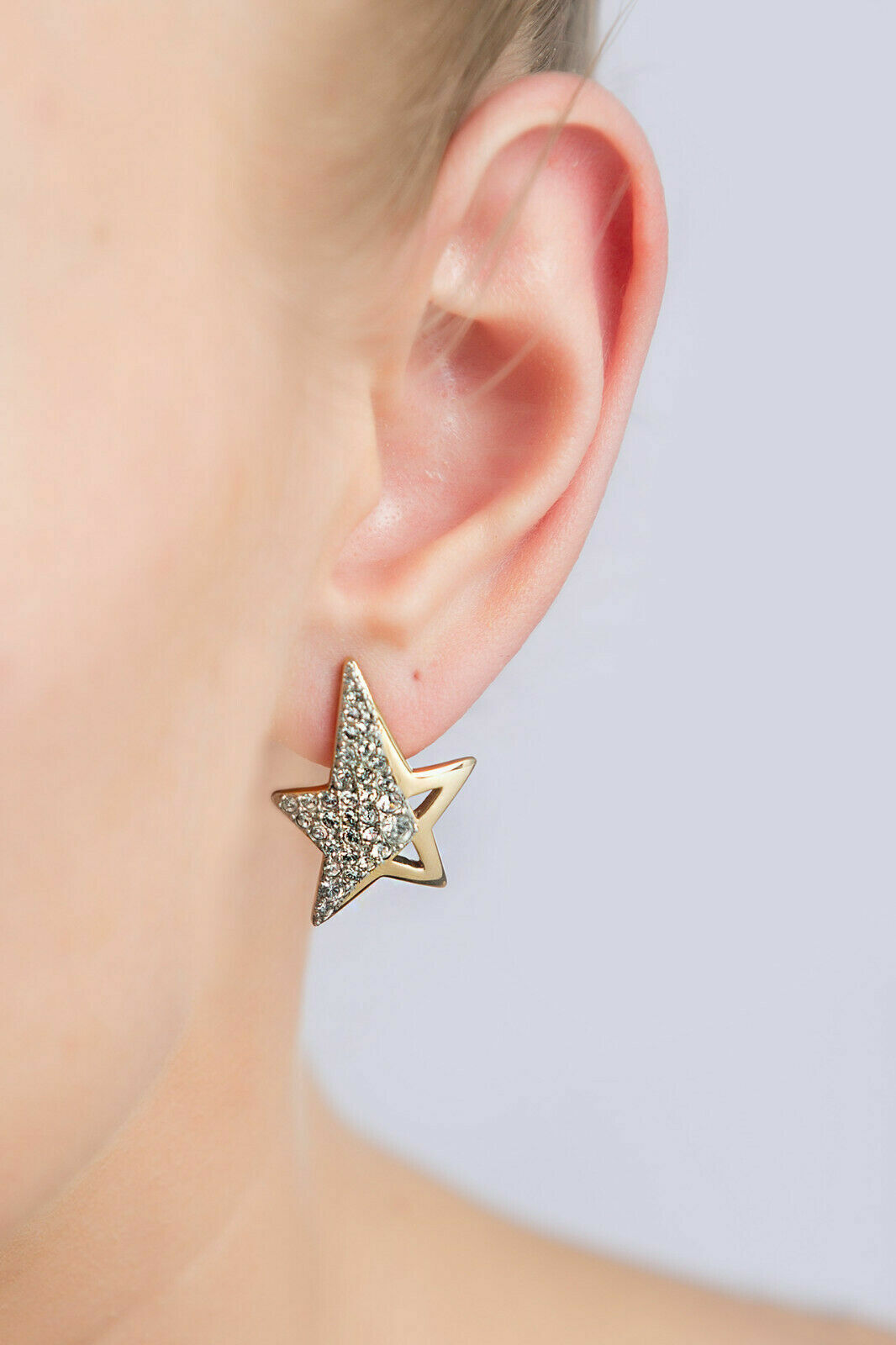 Boucles d'oreilles étoile Thierry Mugler dorées et zirconium pour femme