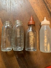 vintage glass baby doll bottles
