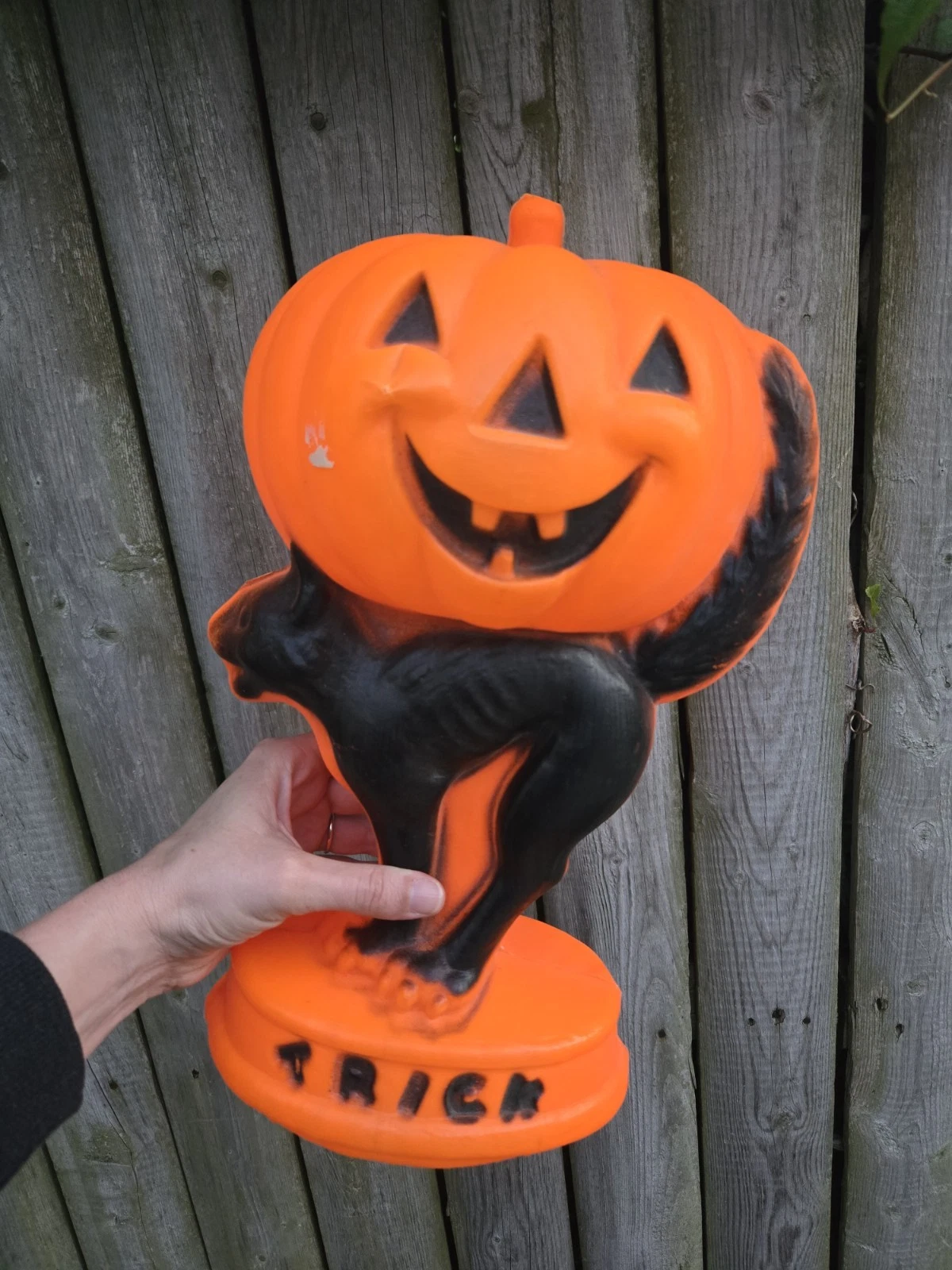 Vintage Halloween blow mold decor featuring a jack-o'-lantern and a black cat