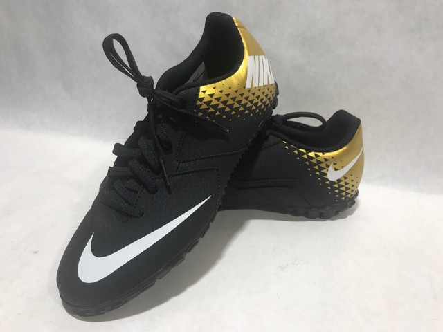 black and gold nike turfs